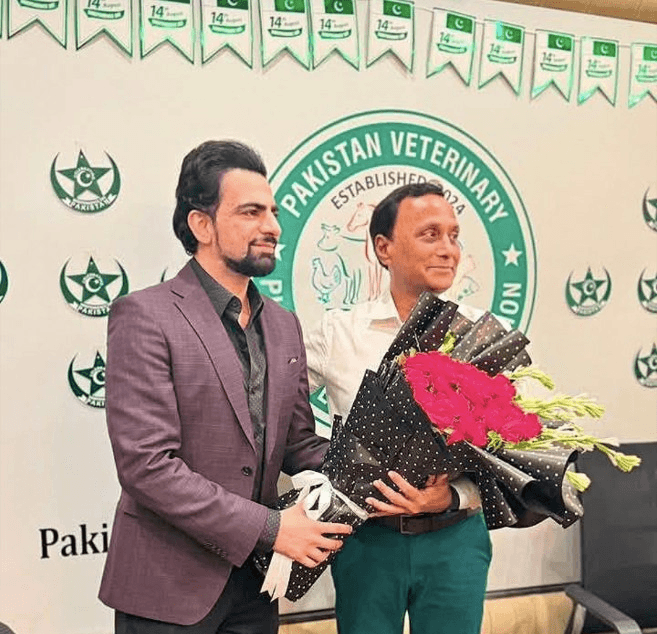 Mr Shoaib Amjad, Vice Chairman (North), presenting a bouquet to Chairman Dr Asim Mahmood Khan at PVPA House