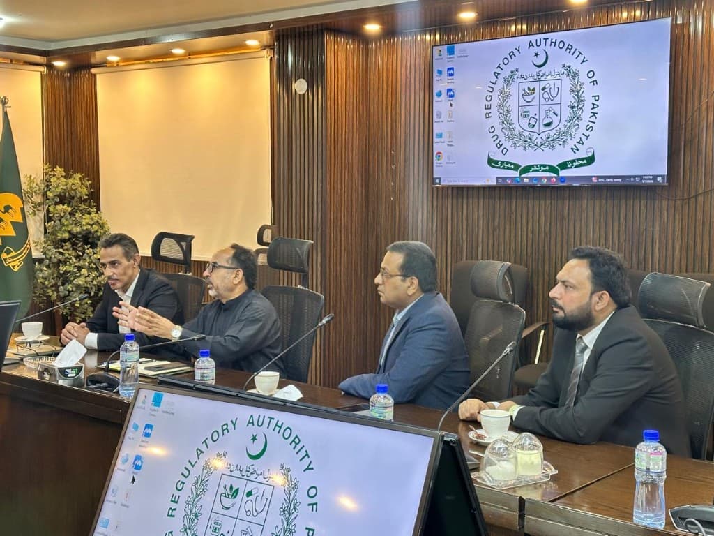Chairman Dr Asim Mahmood Khan and Dr Obaid Ullah Malik at the DRAP conference table